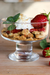 dessert in a glass of cookies, strawberries and cottage cheese