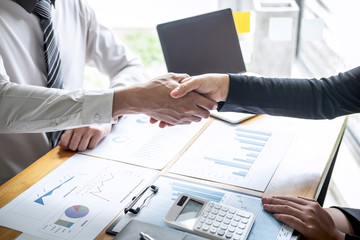 Finishing up a conversation after collaboration, handshake of two business people after contract agreement to become a partner, collaborative teamwork