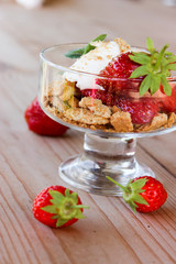 dessert in a glass of cookies, strawberries and cottage cheese