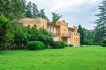 Fototapeta na wymiar museum building next to the Dadiani palace in a park in Zugdidi.