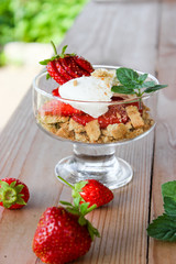 dessert in a glass of cookies, strawberries and cottage cheese