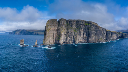 Fototapeta na wymiar Risin og Kellingin, The Giant and the Witch, sea stacks rocks near Eidi, Faroe Islands 16:9