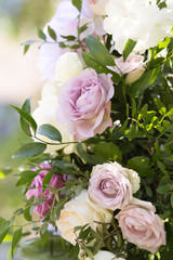Beautiful wedding decoration ceremony. Modern bouquet of different flowers and green leaf.