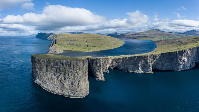 Leitisvatn lake and Tralanipan-slave rock, near Bosdalafossur waterfall on Vagar, Faroe Islands