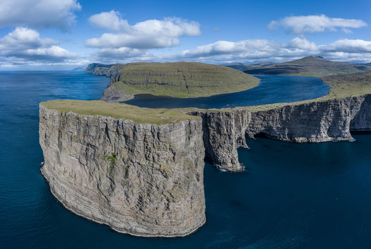 Leitisvatn lake and Tralanipan-slave rock, near Bosdalafossur waterfall on Vagar, Faroe Islands