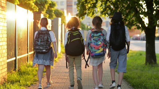 Four Friends Are Going to School. They Have A Lot of Fun Because Today is Their First Day at School.