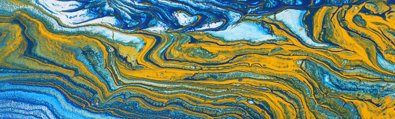 photography of abstract marbleized effect background. Blue, mint, yellow and white creative colors. Beautiful paint. banner
