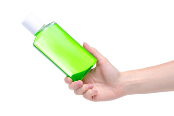 Green mouthwash dental care in hand on a white background. Isolation