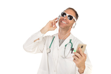 Handsome doctor with sunglasses listening music with headphones