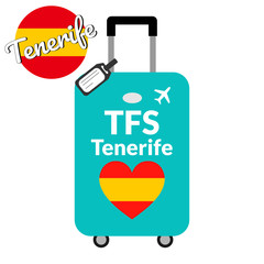 Luggage with airport station code IATA or location identifier and destination city name Tenerife, TFS. Travel to Spain, Europe concept. Heart shaped flag of the Spain on baggage.