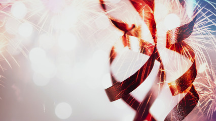 Double exposure of ribbons, fireworks and blurred bokeh in vivid colorful style for 4th of July,...