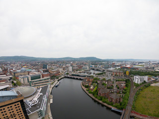 Fototapeta na wymiar aerial view on river and bridge in belfast northern ireland. beautiful landscape by city view from above