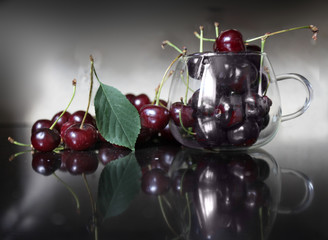 Red ripe cherry lying on the table