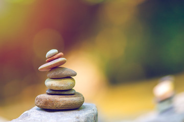 stack of zen stones on pebble beach