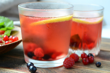 Cold berry lemonade in glasses Summer refreshing drink