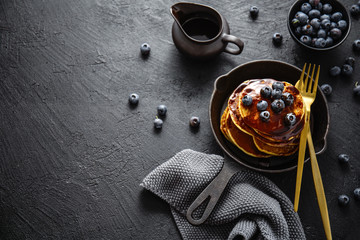 Tasty homemade pancakes with sauce and berries