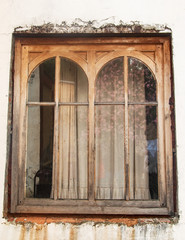 old wooden window on white wall