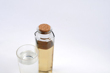 Clean water in glass and dirty water in bottle glass on white background