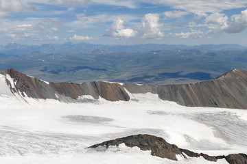 Western Mongolia mountainous landscape. View at Potanin glacier from slope of Khuiten Peak. Altai Tavan Bogd National Park, Bayan-Ulgii Province, Mongolia.