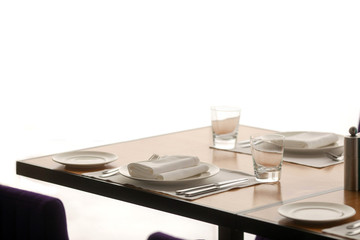 Violet chairs beside table setting in simple minimalist style on white background