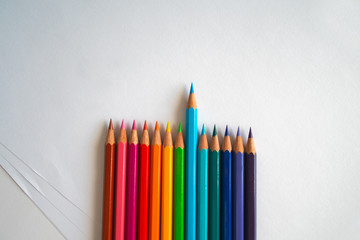 Photo of many color pencils on white background. Various colors. Advertising, blog post, newsletters.