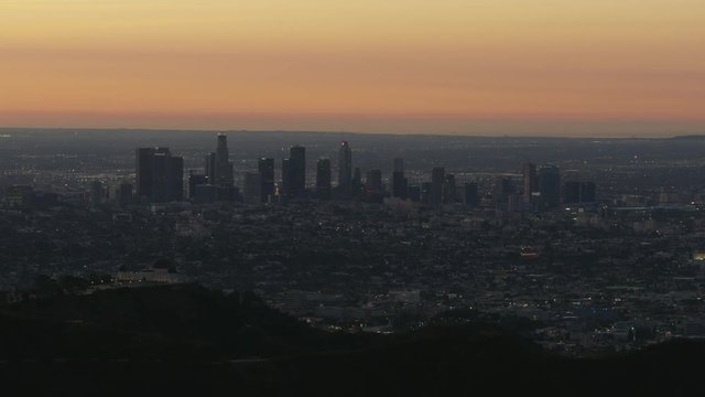 Aerial view Los Angeles cityscape lights at sunrise