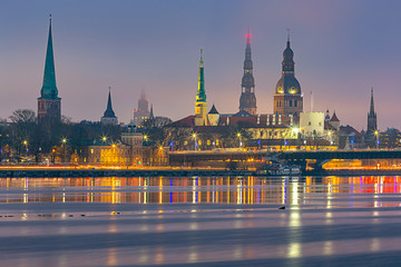 Riga. View of the city embankment and the old city at sunset.