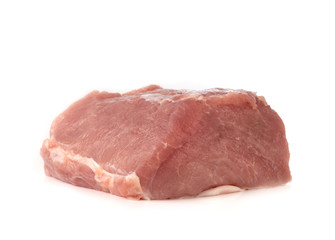 A piece of meat on a white background. Raw piece of pork close-up.