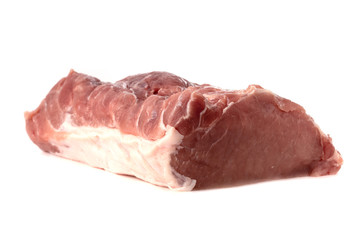 A piece of meat on a white background. Raw piece of pork close-up.