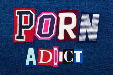 PORN ADDICT word text collage, multi colored fabric on blue denim, pornography and addiction concept, horizontal aspect