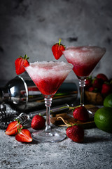Strawberry margarita cocktail and ingredients, copy space