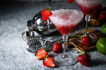 Strawberry margarita cocktail and ingredients, copy space