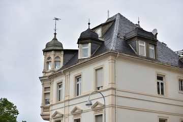Fototapeta na wymiar Beautiful exterior of the upper floor with a roof of a residential building in Europe, Germany