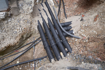 The European system of laying underground utilities from black pipes of water supply, sewage and power cables. Germany