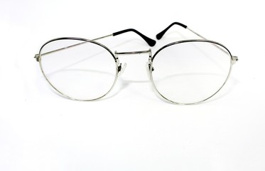 Fototapeta premium Round eye glasses on a white background