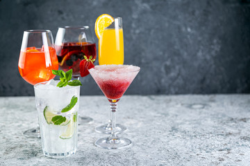 Selection of refreshing summer drinks - mojito, sangria, mimosa, aperol, martini, rustic background...