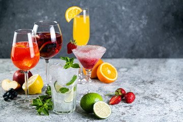 Selection of refreshing summer drinks - mojito, sangria, mimosa, aperol, martini, rustic background...