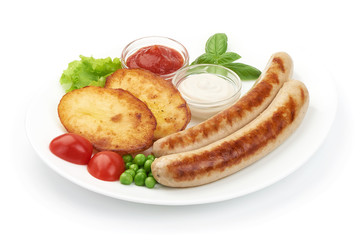 Grilled sausages with baked potatoes, close-up, isolated on white background