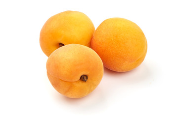 Juicy apricot fruits, fresh nectarines, close-up, isolated on white background