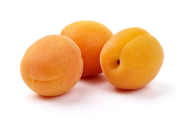 Sweet juicy apricots, ripe nectarines, close-up, isolated on white background