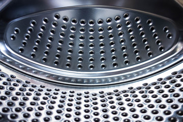 Abstract metal background with dot holes. Curves structure form and grid lines. Industrial design pattern in silver or stainless steel color