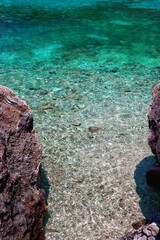 rocks in blue clear water
