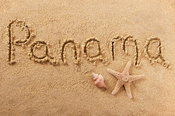 Fototapeta na wymiar Panama word written in sand on a sunny summer beach with starfish holiday vacation travel destination sign writing message photo