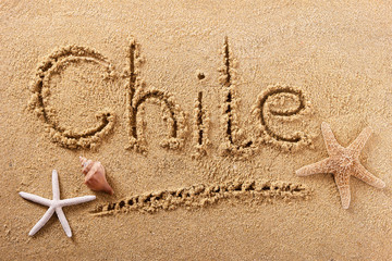 Fototapeta na wymiar Chile word written in sand on a sunny summer beach with starfish holiday vacation travel destination sign writing message photo