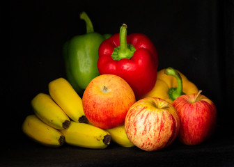 Colorful fruits and vegetables in a black background