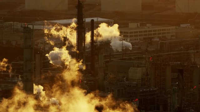 Aerial sunset view windsocks oil refinery infrastructure LA