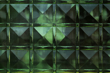 Green texture of thick glass in the form of squares