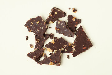 Homemade dark chocolate with walnut. Raw chocolate with nuts, kerob, stevia, acai, guarana. Selective focus, close up