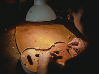 Luthier working on the violin
