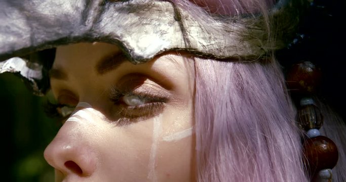 exciting woman takes off venecian mask from white lens eyes
